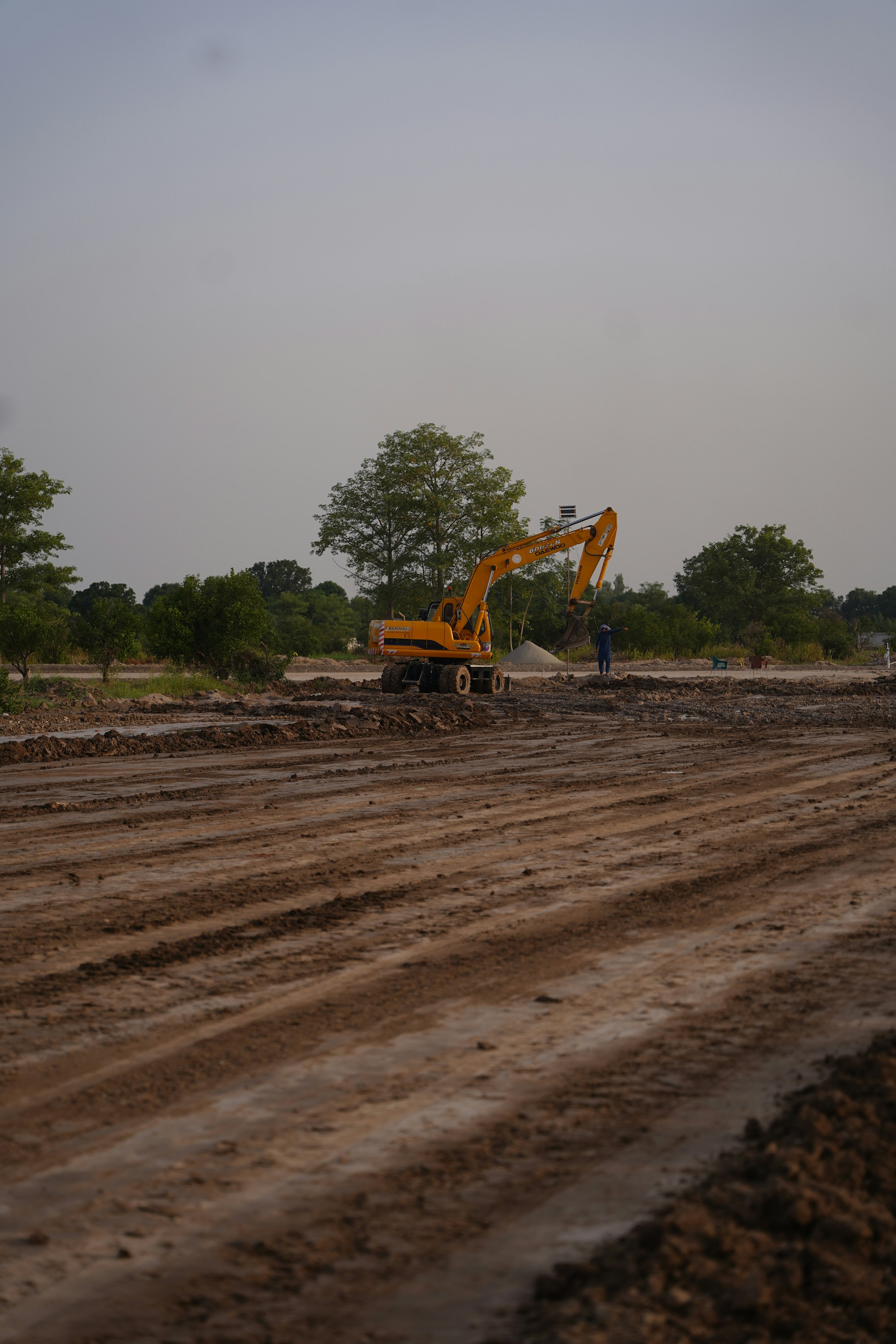 Excavator operating on an active earthworks site